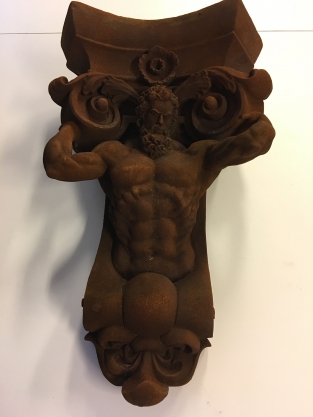 Very striking wall bracket -ornament with garing man, Polystone rest.